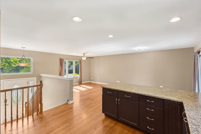 357 Sword Way, Bolingbrook, IL 60440 - kitchen with light wood-style floors, recessed lighting, ceiling fan, dark brown cabinets, and pendant lighting