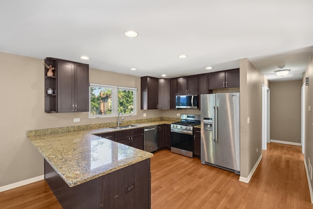 357 Sword Way, Bolingbrook, IL 60440 - kitchen featuring appliances with stainless steel finishes, dark brown cabinetry, a peninsula, light wood-style floors, and recessed lighting