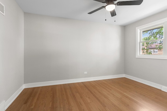 232 S Walnut St, Glenwood, IL 60425 - empty room with light wood finished floors and a ceiling fan