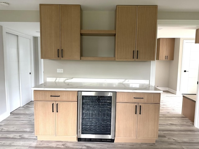 232 S Walnut St, Glenwood, IL 60425 - kitchen with beverage cooler, open shelves, light wood-style floors, and light stone countertops