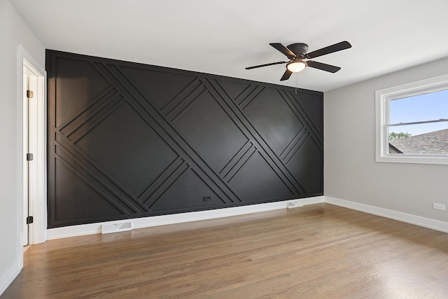 232 S Walnut St, Glenwood, IL 60425 - unfurnished room featuring light wood finished floors and a ceiling fan