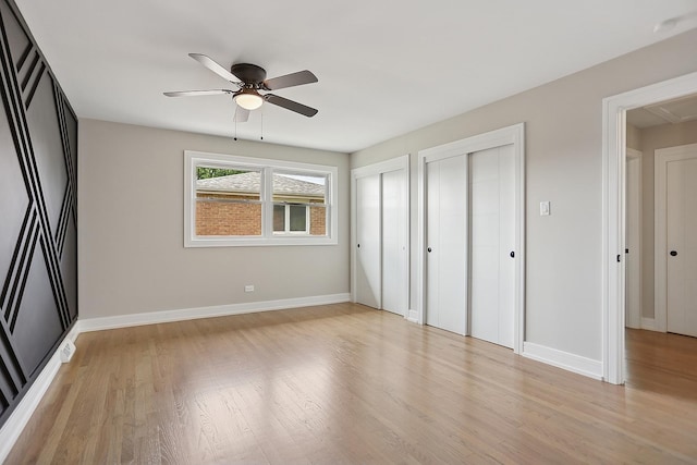 232 S Walnut St, Glenwood, IL 60425 - unfurnished bedroom featuring two closets, light wood-type flooring, attic access, and a ceiling fan