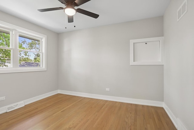 232 S Walnut St, Glenwood, IL 60425 - empty room featuring light wood-style flooring and ceiling fan