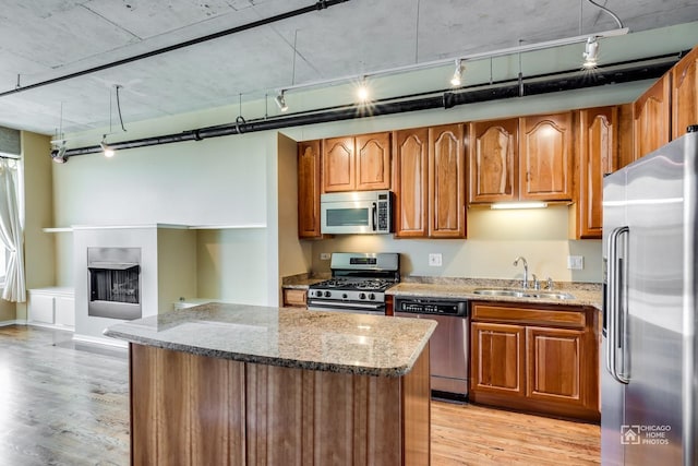 6 S Laflin St Unit 712, Chicago, IL 60607 - kitchen with stainless steel appliances, track lighting, and light wood finished floors