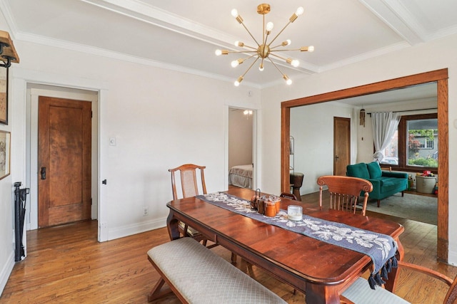 837 Wesley Ave, Oak Park, IL 60304 - dining area with light wood-style flooring, a chandelier, and ornamental molding