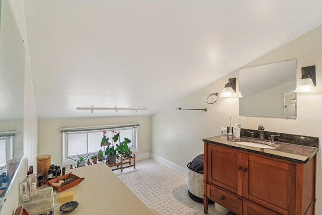 837 Wesley Ave, Oak Park, IL 60304 - bathroom featuring vanity, track lighting, and vaulted ceiling