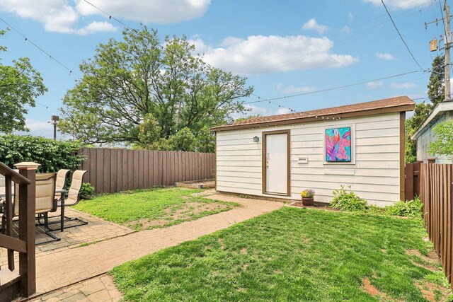 837 Wesley Ave, Oak Park, IL 60304 - fenced backyard featuring a patio and an outbuilding