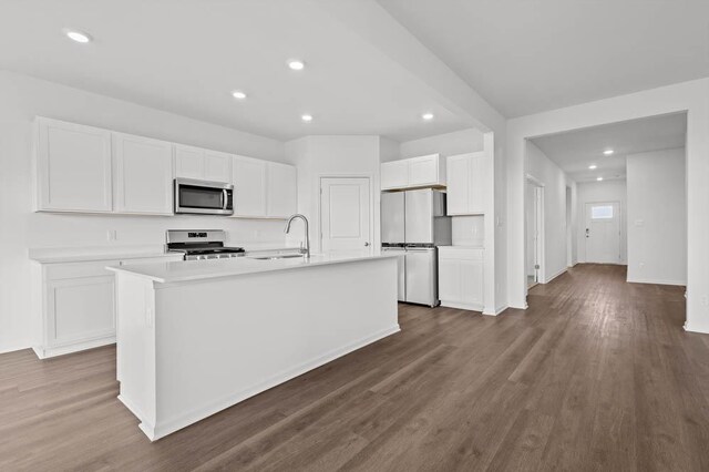 9900 Humbolt St, Huntley, IL 60142 - kitchen featuring stainless steel appliances, white cabinets, recessed lighting, a kitchen island with sink, and dark wood-style floors