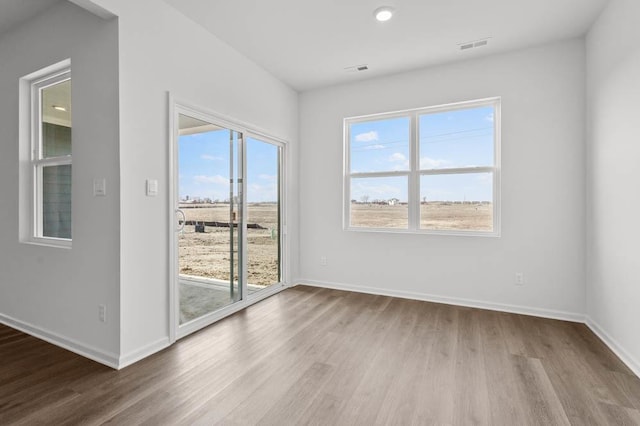 9900 Humbolt St, Huntley, IL 60142 - empty room with wood finished floors and recessed lighting