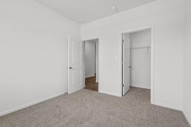 9900 Humbolt St, Huntley, IL 60142 - unfurnished bedroom with carpet floors, a spacious closet, and a closet