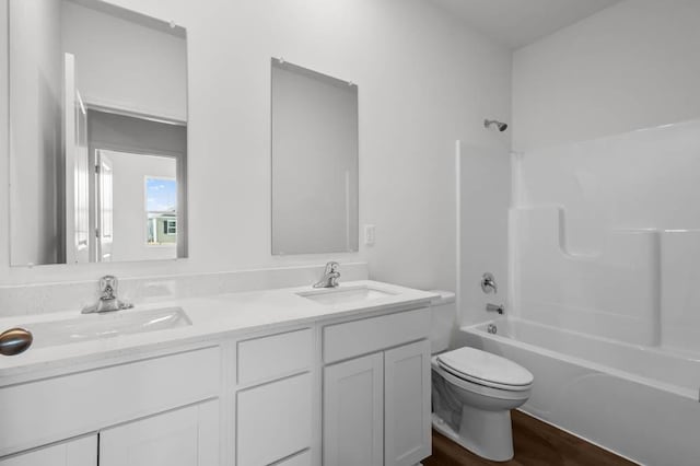 9900 Humbolt St, Huntley, IL 60142 - bathroom featuring double vanity, shower / bathtub combination, and wood finished floors