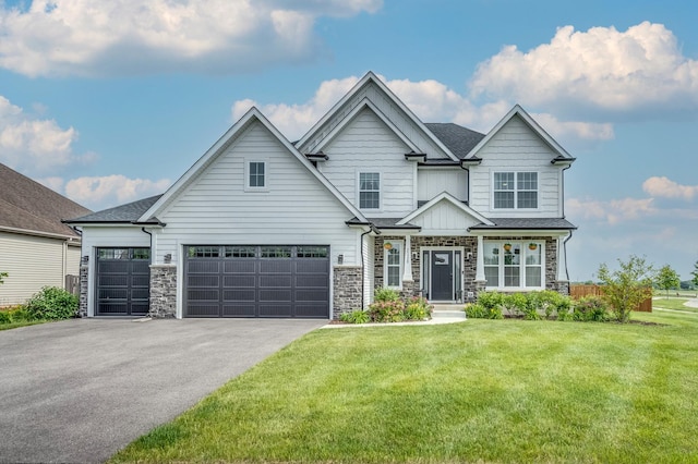 25320 W Alison Rd, Plainfield, IL 60586 - view of front of home with driveway, a front lawn, stone siding, and board and batten siding