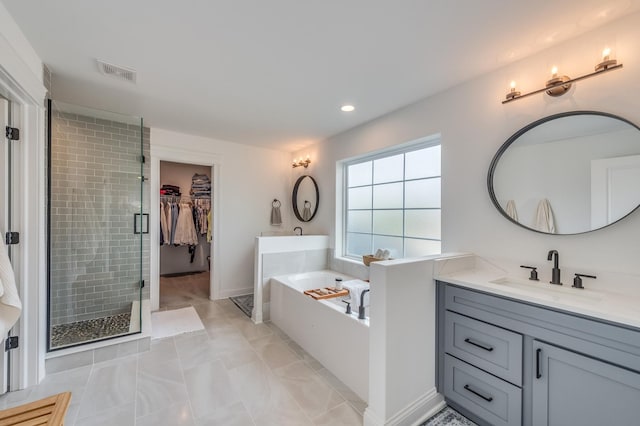 25320 W Alison Rd, Plainfield, IL 60586 - bathroom featuring vanity, a bath, a stall shower, marble finish flooring, and recessed lighting