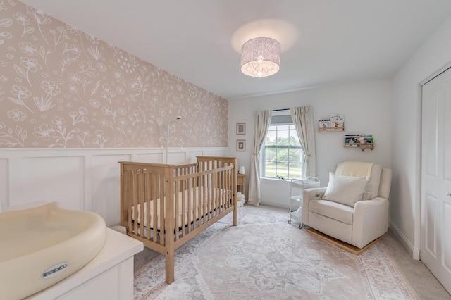 25320 W Alison Rd, Plainfield, IL 60586 - bedroom with wallpapered walls, a wainscoted wall, a nursery area, and light colored carpet