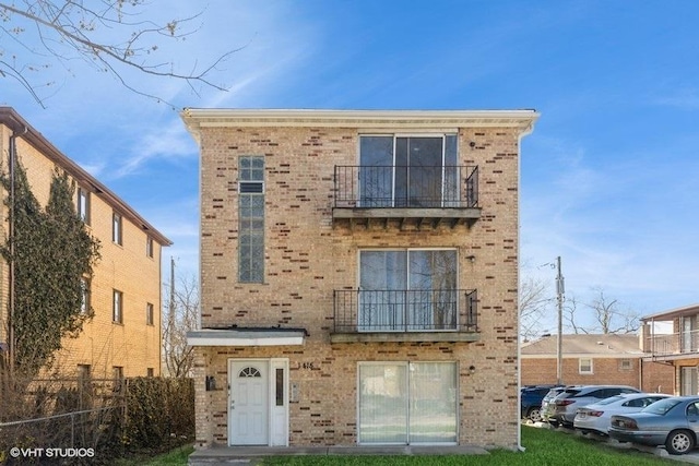 1415 W 123rd St, Calumet Park, IL 60827 - view of front facade with a balcony and brick siding
