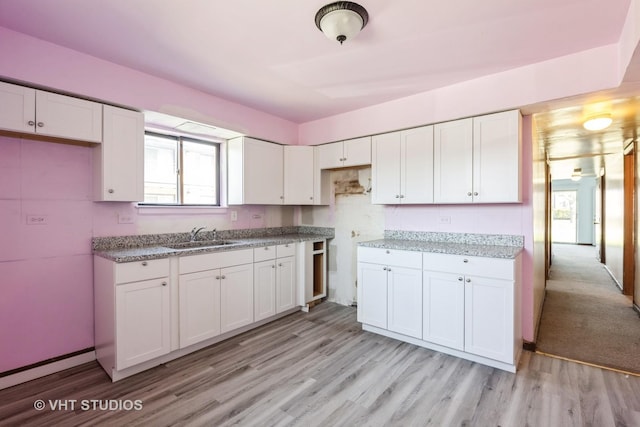1415 W 123rd St, Calumet Park, IL 60827 - kitchen featuring white cabinets, light wood-style floors, and light stone counters