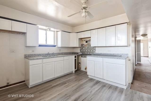 1415 W 123rd St, Calumet Park, IL 60827 - kitchen featuring light wood finished floors, white cabinetry, a ceiling fan, and backsplash