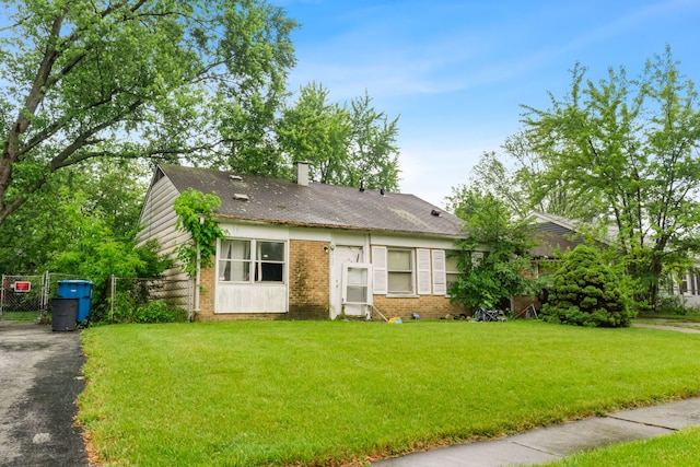 2124 218th St, Sauk Village, IL 60411 - view of front of property with brick siding, a chimney, and driveway