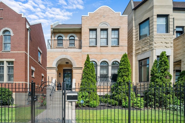 4741 S Drexel Blvd, Chicago, IL 60615 - view of front of property with a balcony, brick siding, a gate, and a fenced front yard