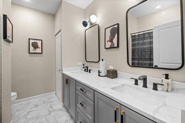4741 S Drexel Blvd, Chicago, IL 60615 - bathroom with marble look tiles, double vanity, and recessed lighting