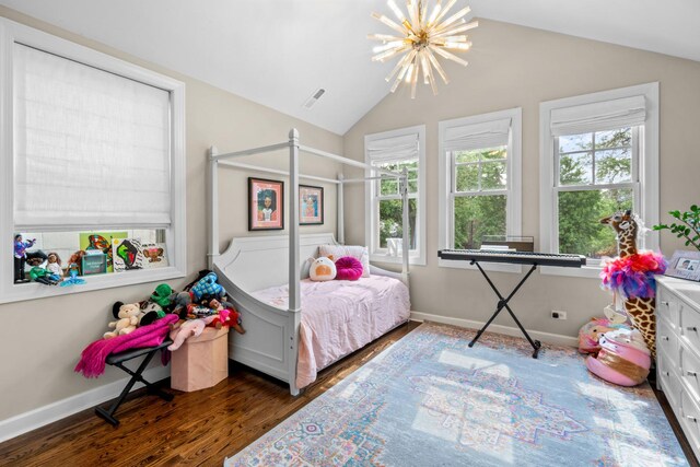 4741 S Drexel Blvd, Chicago, IL 60615 - bedroom with multiple windows, wood finished floors, a chandelier, and vaulted ceiling