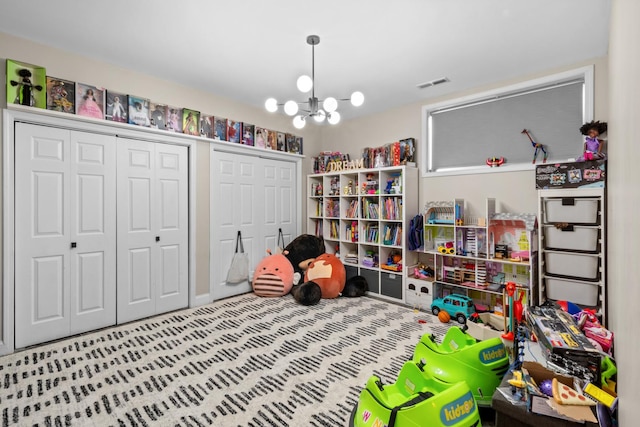 4741 S Drexel Blvd, Chicago, IL 60615 - playroom featuring a chandelier and carpet floors