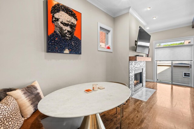 4741 S Drexel Blvd, Chicago, IL 60615 - dining room featuring crown molding, wood finished floors, a tiled fireplace, and recessed lighting