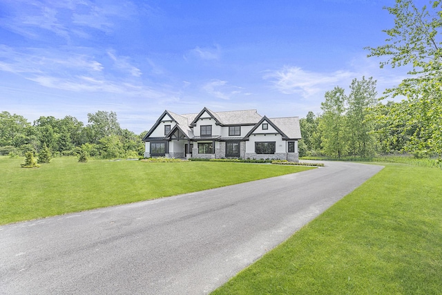 106 Brookwood Ln, Lincolnshire, IL 60069 - view of front of home featuring stone siding and a front lawn