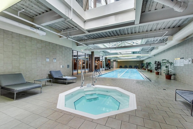 222 N Columbus Dr Unit 1405, Chicago, IL 60601 - indoor pool featuring a hot tub and a patio area