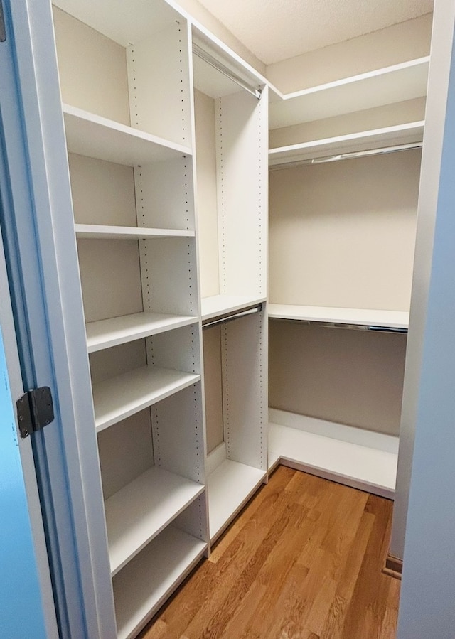 222 N Columbus Dr Unit 1405, Chicago, IL 60601 - walk in closet featuring wood finished floors