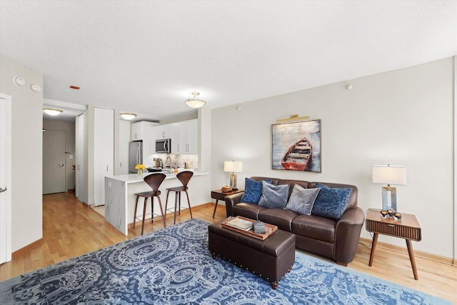 222 N Columbus Dr Unit 1405, Chicago, IL 60601 - living area featuring light wood-type flooring and baseboards