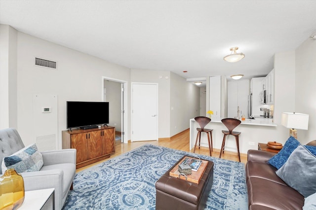 222 N Columbus Dr Unit 1405, Chicago, IL 60601 - living room with light wood-style floors and baseboards