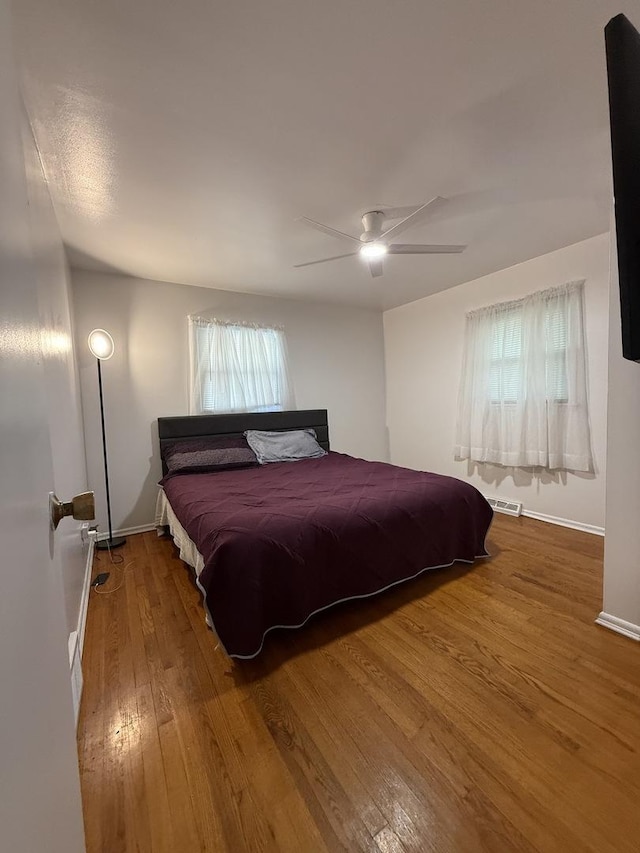 3033 189th St, Lansing, IL 60438 - bedroom with wood finished floors and ceiling fan