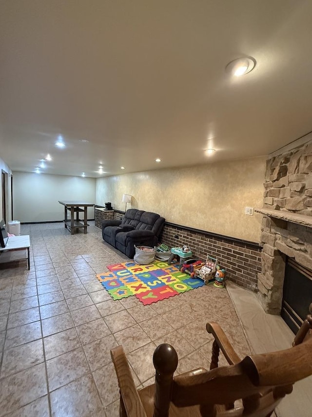 3033 189th St, Lansing, IL 60438 - living room featuring a stone fireplace, tile patterned floors, and recessed lighting