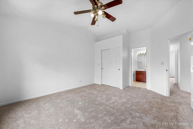 609 Cary Woods Cir, Cary, IL 60013 - unfurnished bedroom with light colored carpet, lofted ceiling, ensuite bathroom, and a ceiling fan
