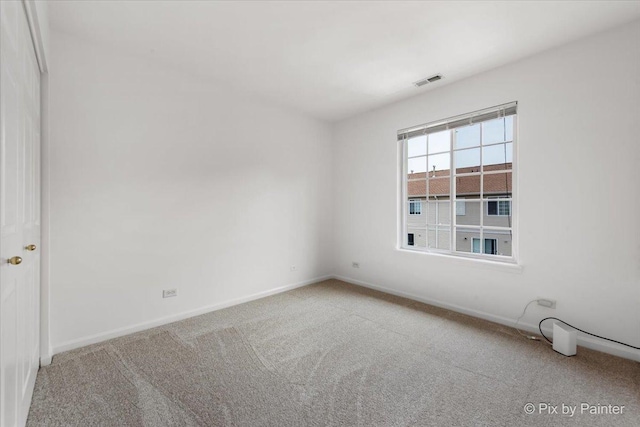 609 Cary Woods Cir, Cary, IL 60013 - carpeted spare room featuring baseboards