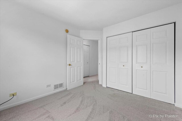 609 Cary Woods Cir, Cary, IL 60013 - unfurnished bedroom with carpet flooring and a closet