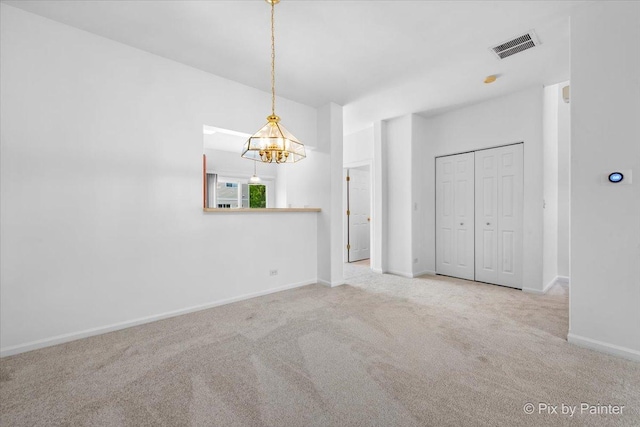 609 Cary Woods Cir, Cary, IL 60013 - unfurnished dining area featuring carpet floors and a chandelier