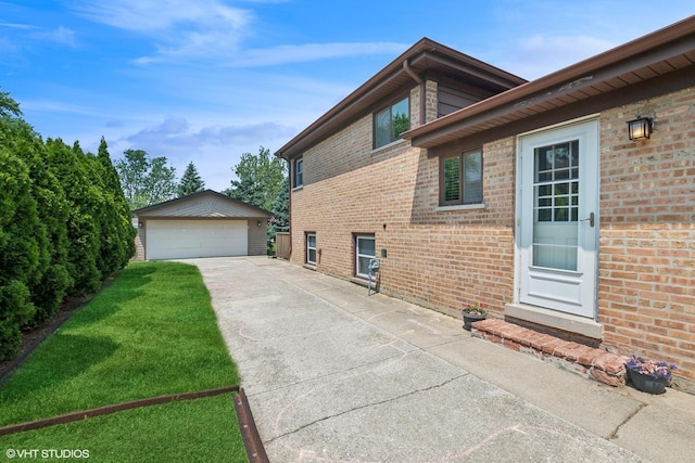 10824 Lavergne Ave, Oak Lawn, IL 60453 - view of side of property with an outbuilding, a detached garage, and brick siding