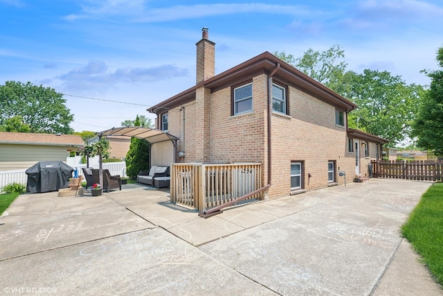 10824 Lavergne Ave, Oak Lawn, IL 60453 - rear view of property with a patio, a chimney, brick siding, and outdoor lounge area