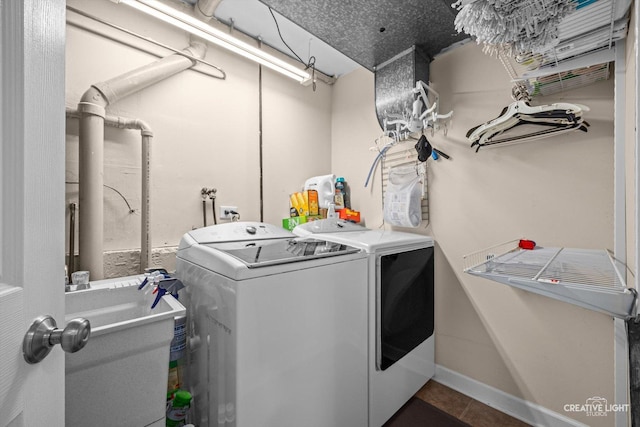 209 Surrey Dr, Carol Stream, IL 60188 - laundry area featuring washing machine and dryer and dark tile patterned flooring