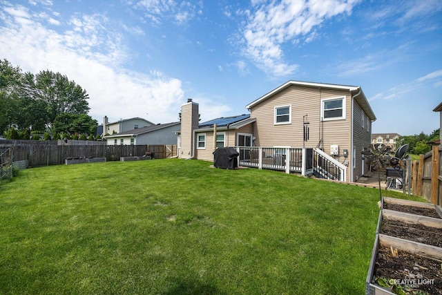 209 Surrey Dr, Carol Stream, IL 60188 - rear view of house with a garden and a fenced backyard