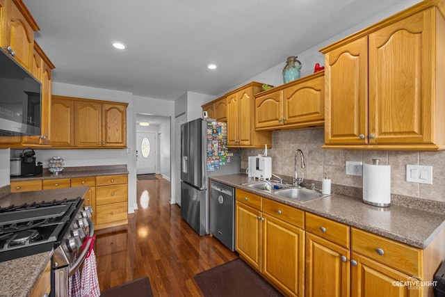 209 Surrey Dr, Carol Stream, IL 60188 - kitchen with appliances with stainless steel finishes, dark wood-style flooring, decorative backsplash, dark countertops, and recessed lighting