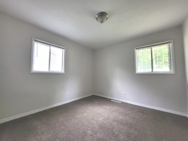 2313 Joppa Ave, Zion, IL 60099 - empty room featuring dark carpet and baseboards