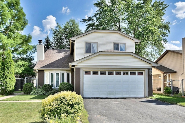 1340 Charger Ct, Carol Stream, IL 60188 - view of front facade with driveway, brick siding, a shingled roof, and a chimney