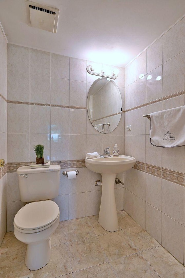 1340 Charger Ct, Carol Stream, IL 60188 - half bathroom featuring tile walls and toilet