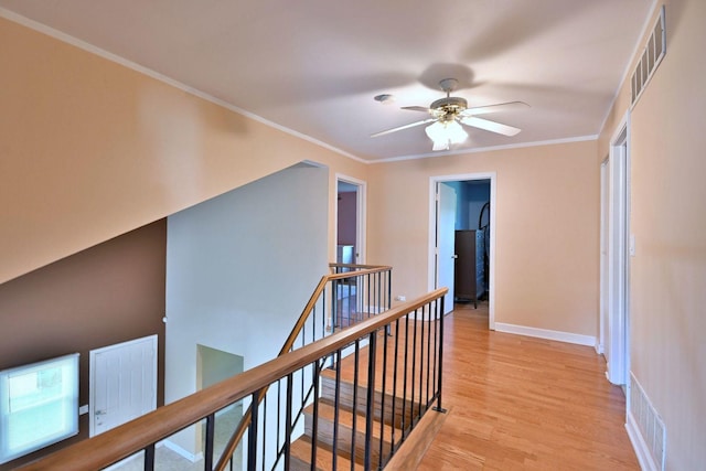 1340 Charger Ct, Carol Stream, IL 60188 - hallway with an upstairs landing, light wood-style flooring, and crown molding