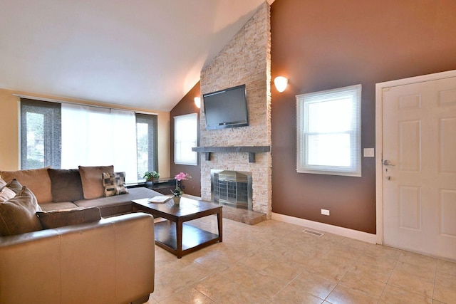 1340 Charger Ct, Carol Stream, IL 60188 - living room with lofted ceiling, a stone fireplace, and light tile patterned floors