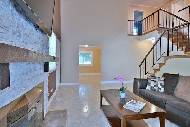 1340 Charger Ct, Carol Stream, IL 60188 - living area featuring stairway, a stone fireplace, and a high ceiling
