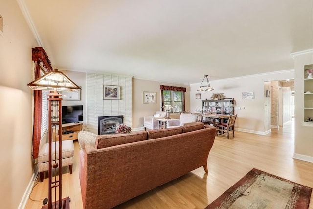 222 Cornell Ave, Des Plaines, IL 60016 - living room with a fireplace, light wood-style flooring, and ornamental molding